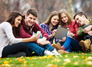 Group of young people using digital tablet and smart phone